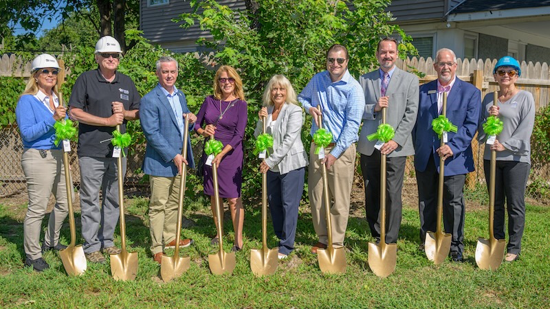group of people with shovels